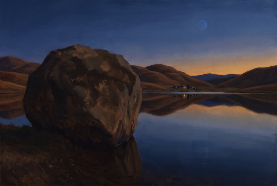 A heavy boulder beside a still lake at dusk: two kinds of stillness